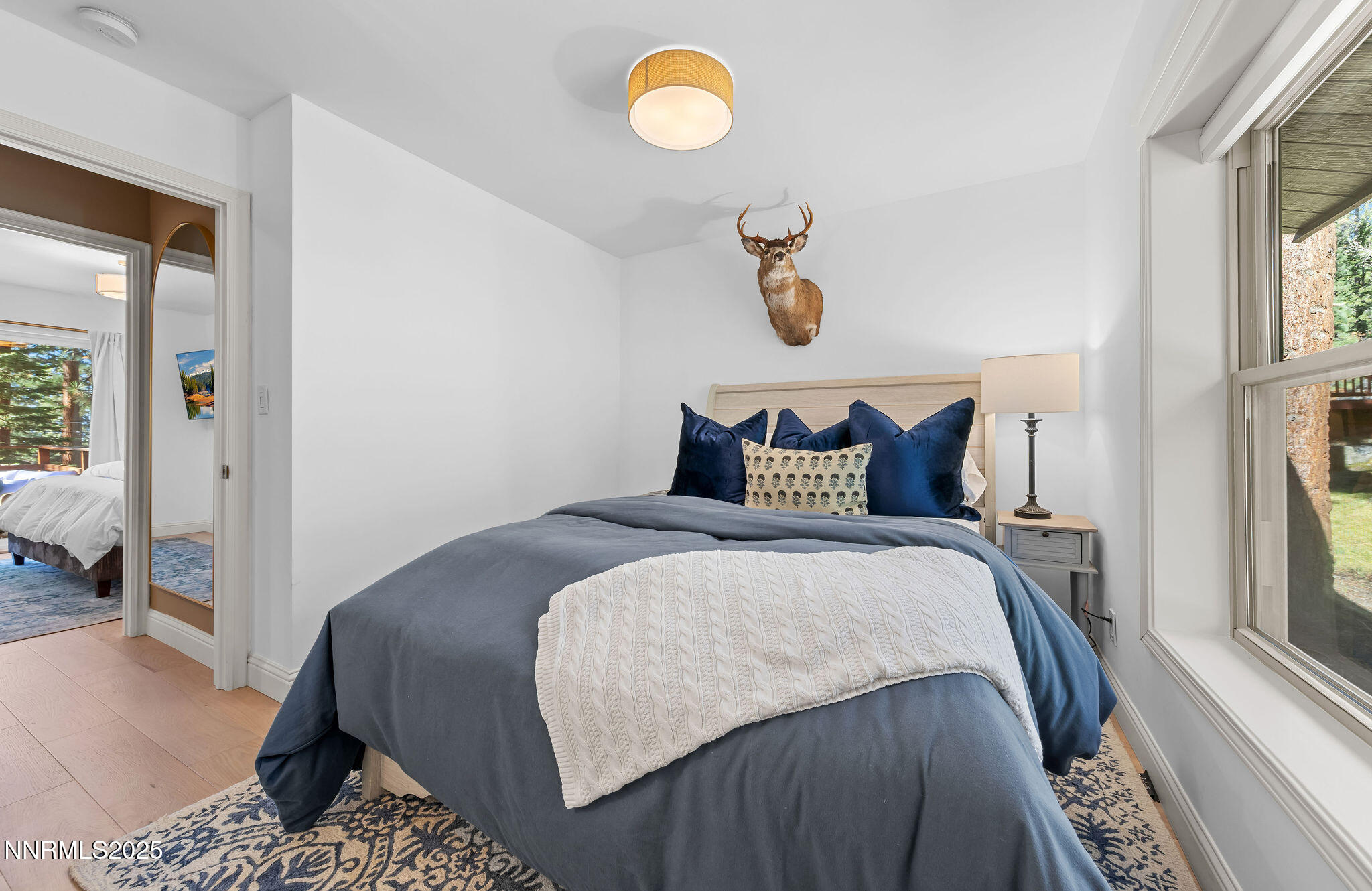 174 Hall Court Stateline, NV 89449 - Photo 27 of 40 a bedroom with a bed and a window