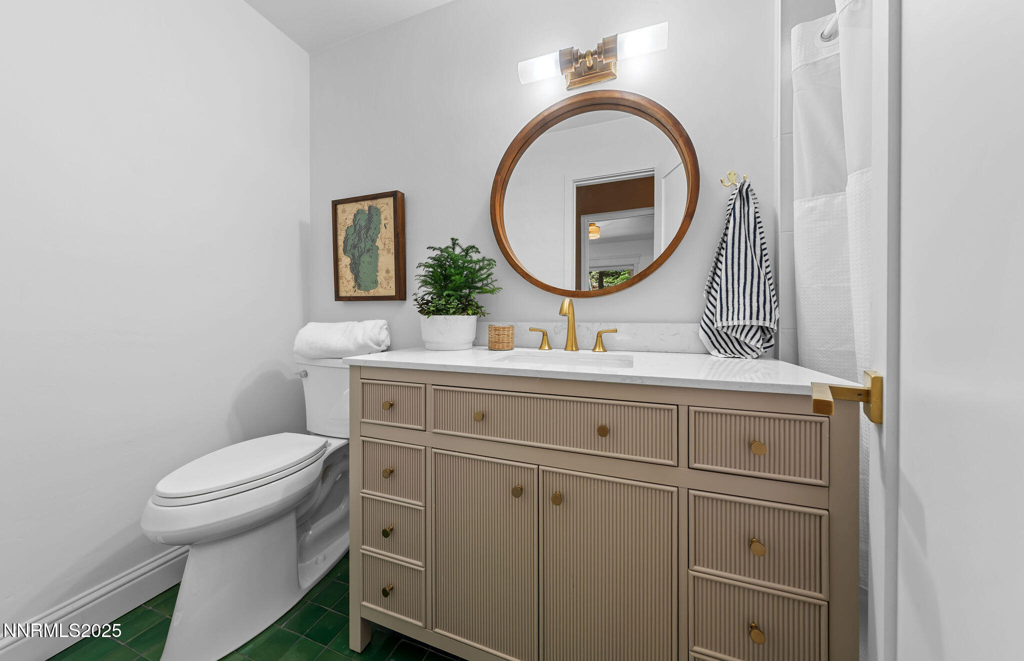 174 Hall Court Stateline, NV 89449 - Photo 29 of 40 a bathroom with a toilet a sink and a mirror