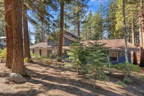 a view of a lush green hillside and a building