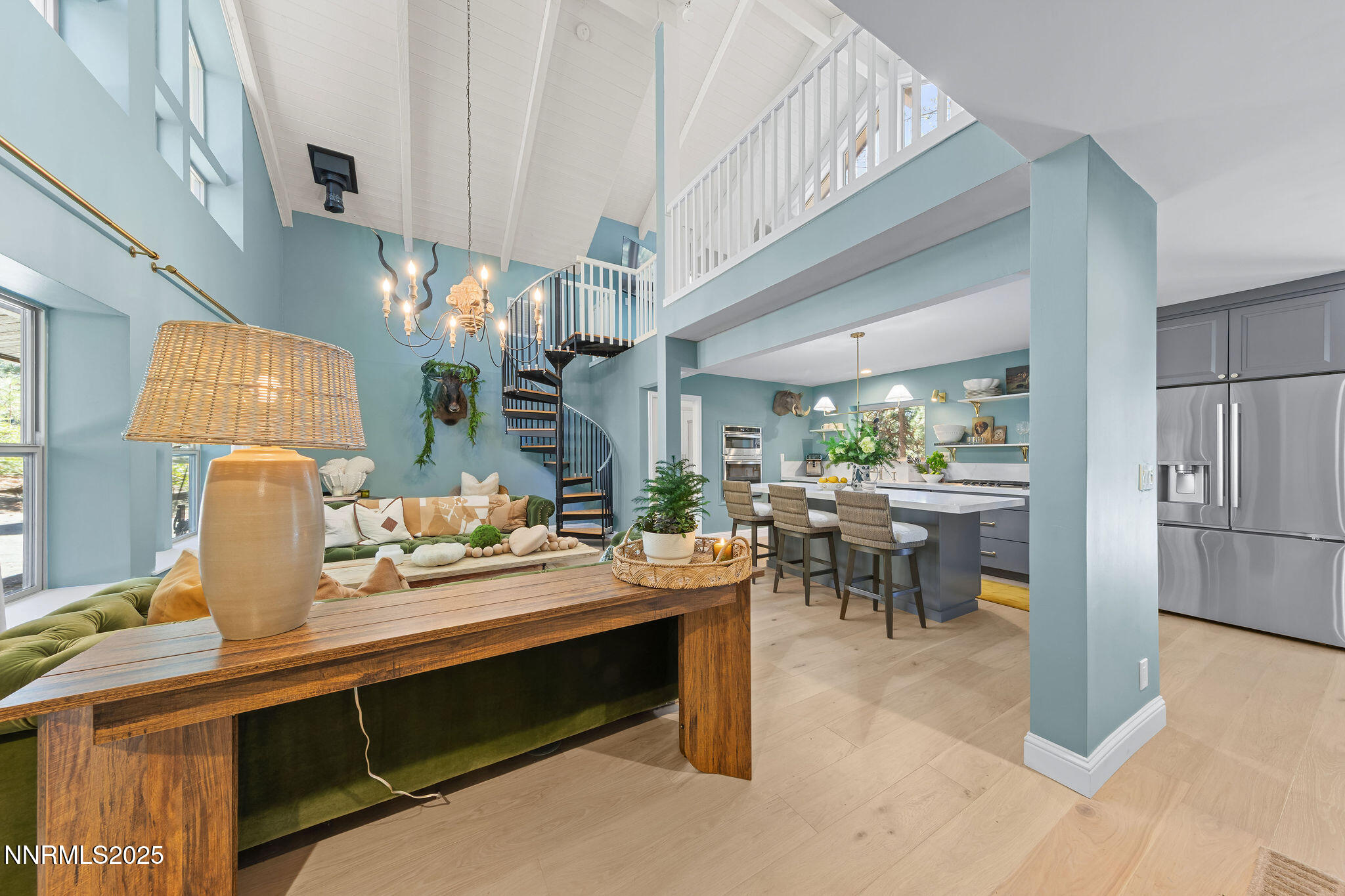 174 Hall Court Stateline, NV 89449 - Photo 4 of 40 a room with lots of wooden furniture a chandelier and a view of living room