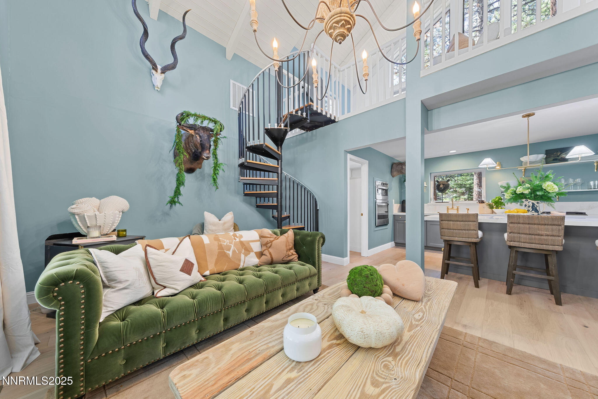 174 Hall Court Stateline, NV 89449 - Photo 5 of 40 a living room with furniture flowers and a chandelier