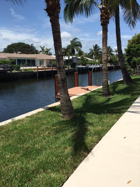 832 Coventry Street Boca Raton, FL 33487 - Photo 8 of 8 a view of a lake with houses