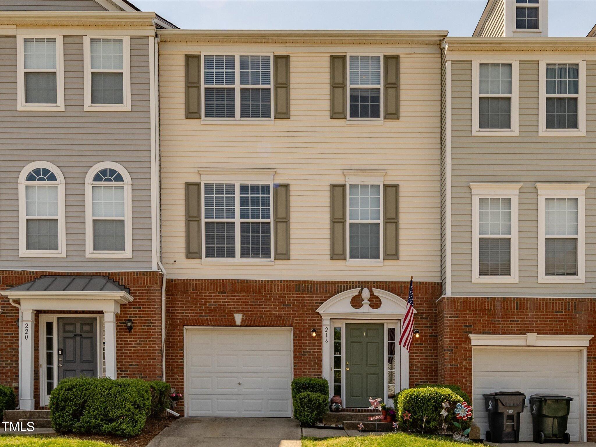216 Ruby Walk Drive Morrisville, NC 27560 - Photo 1 of 28 a front view of a building with glass windows