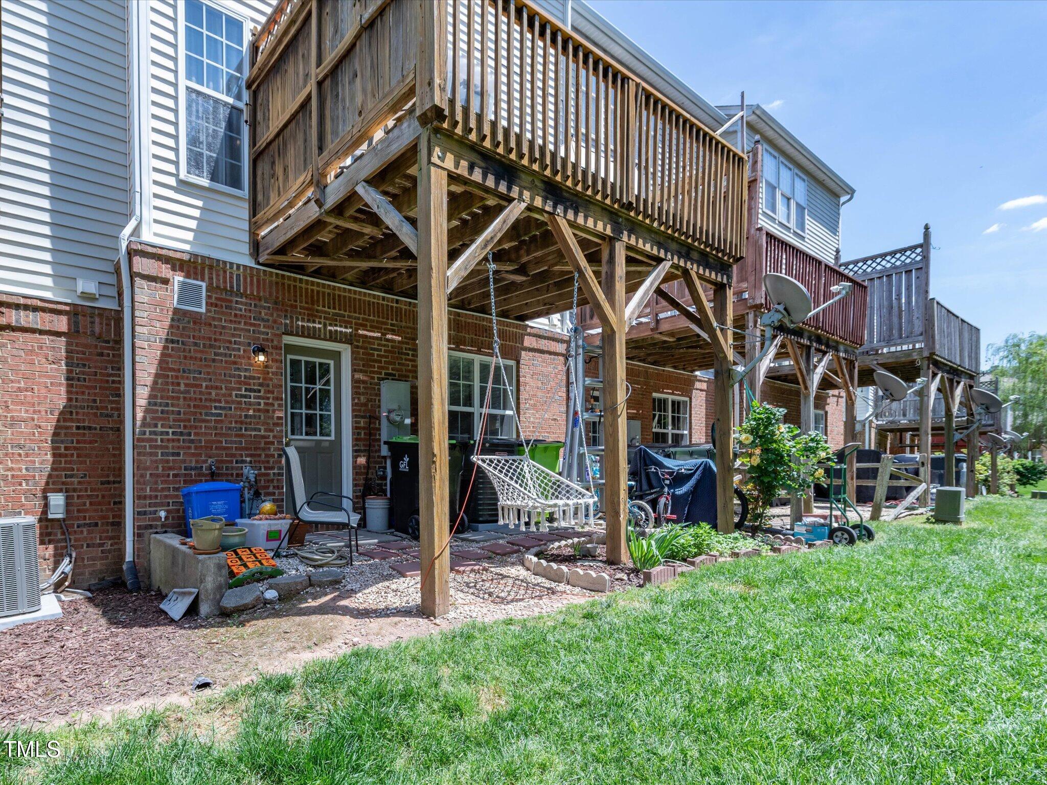 216 Ruby Walk Drive Morrisville, NC 27560 - Photo 7 of 28 a view of a chair and table in front of house