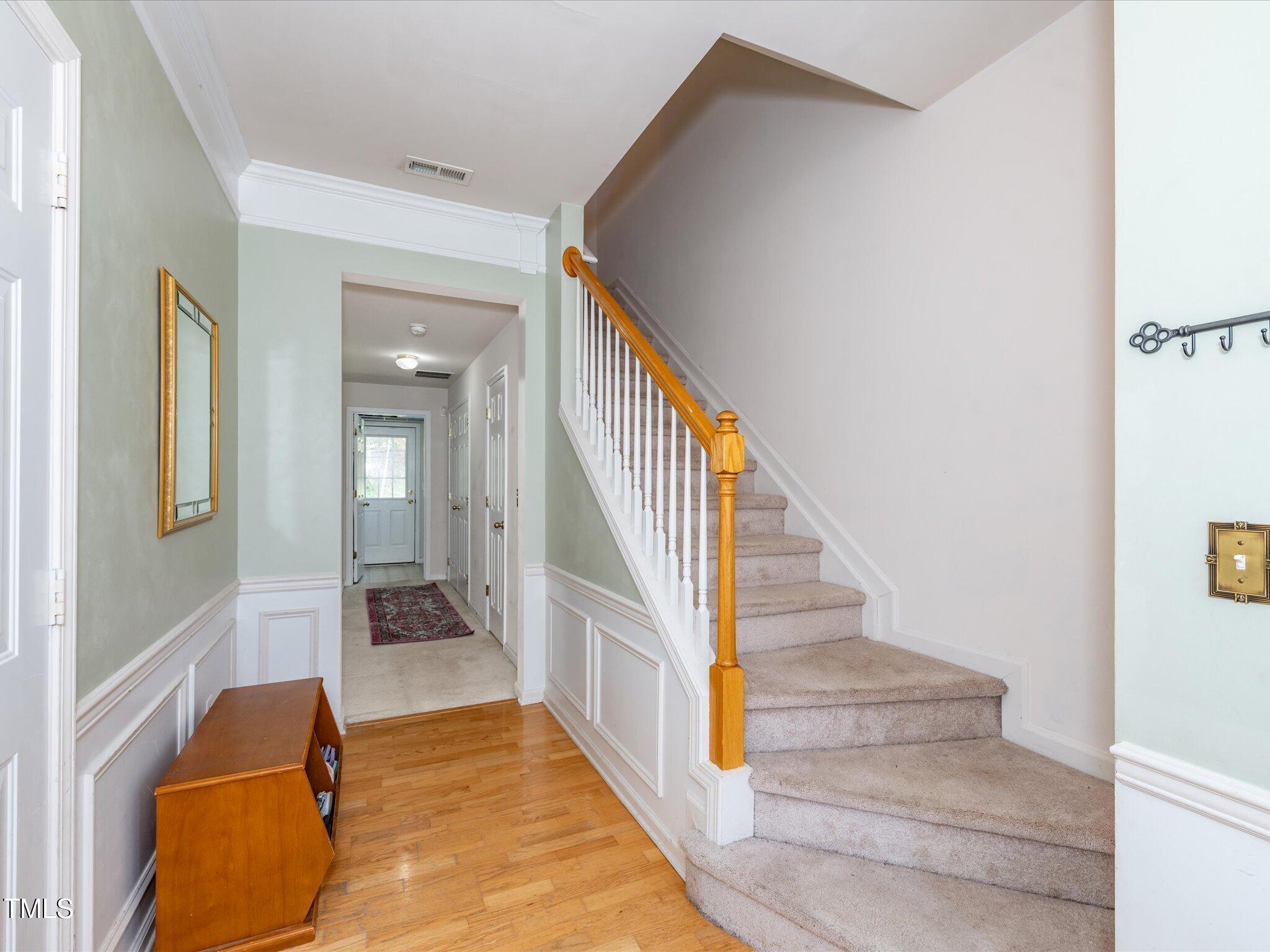216 Ruby Walk Drive Morrisville, NC 27560 - Photo 9 of 28 a view of entryway and hall with wooden floor