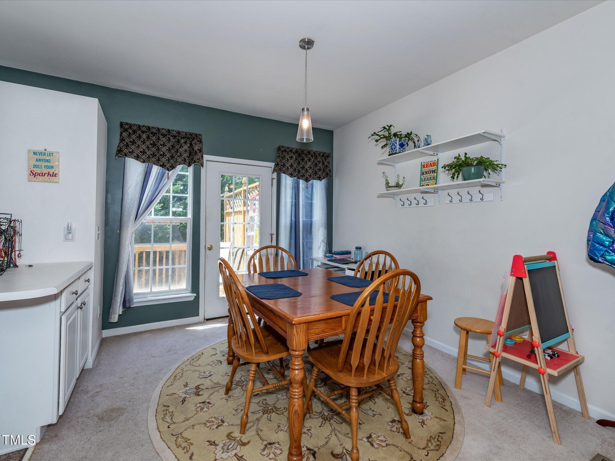 216 Ruby Walk Drive Morrisville, NC 27560 - Photo 15 of 28 a dining room with furniture and window