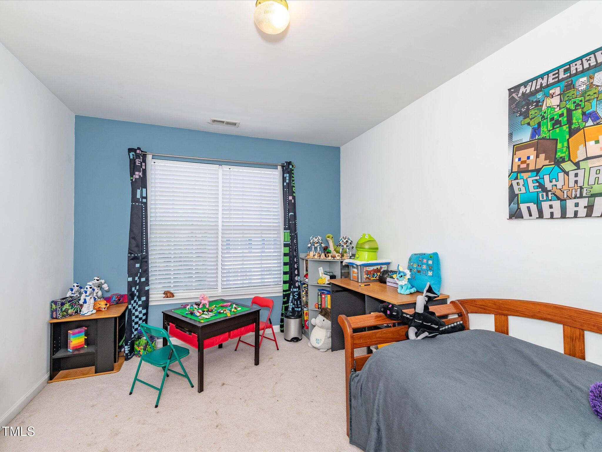 216 Ruby Walk Drive Morrisville, NC 27560 - Photo 21 of 28 a children room with furniture and toys