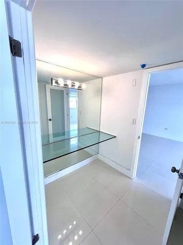 a bathroom with a bathtub and window