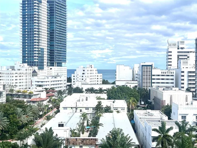 a view of city from balcony with furniture