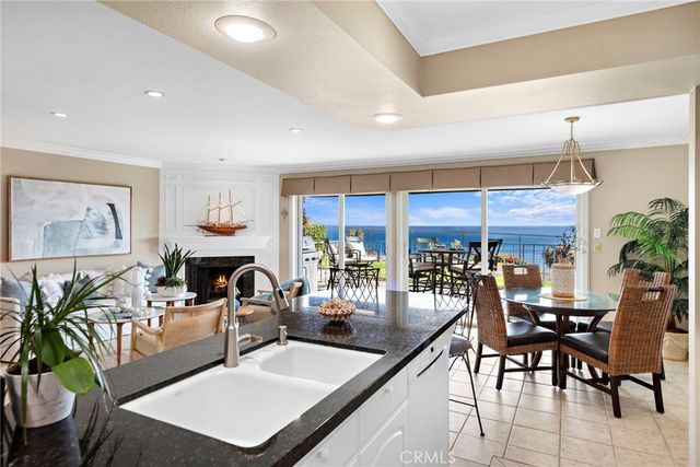 a bathroom with a granite countertop sink a mirror and a shower