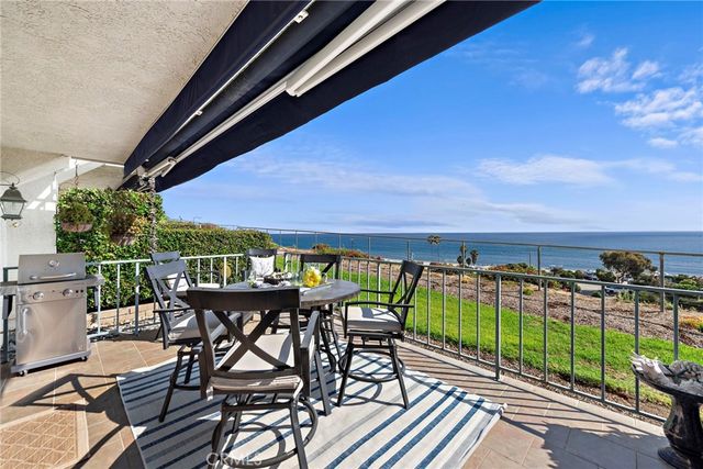 a bedroom with a bed and a dresser next to a window