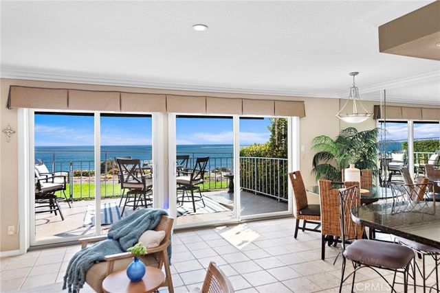 a view of a chairs and table in patio