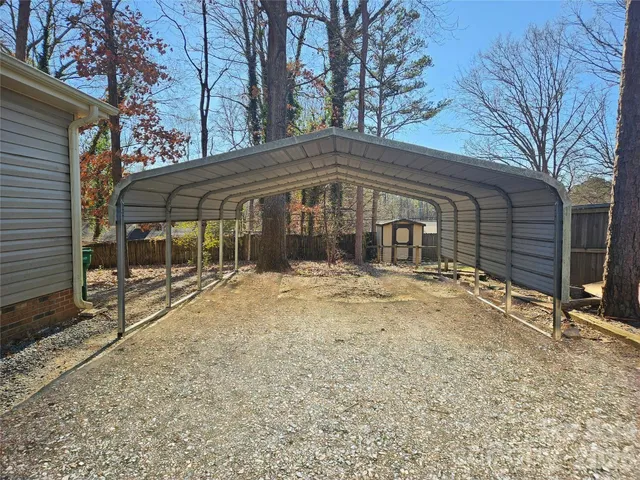 a view of a yard with a tree