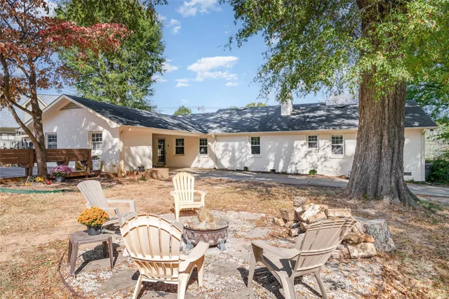 a view of a patio with swimming pool