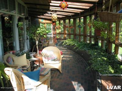 0 Fiddletown Road Kunkletown, PA 18058 - Photo 6 of 10 a view of a patio with table and chairs potted plants and floor to ceiling window