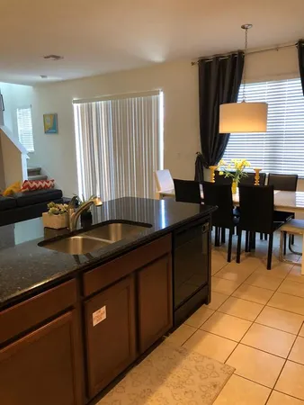 a kitchen with stainless steel appliances granite countertop a sink counter space and cabinets