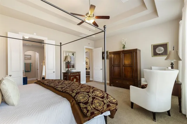 a bedroom with a bed dresser and a walk in closet