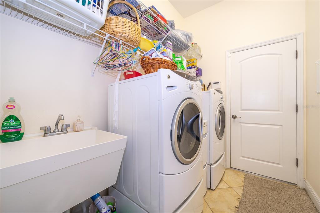 1607 Oak Hollow Road Clermont, FL 34711 - Photo 21 of 30 a utility room with dryer and washer