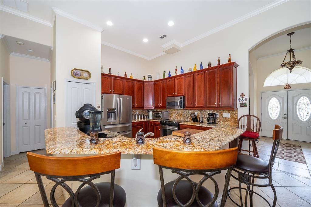1607 Oak Hollow Road Clermont, FL 34711 - Photo 23 of 30 a view of a dining room with furniture
