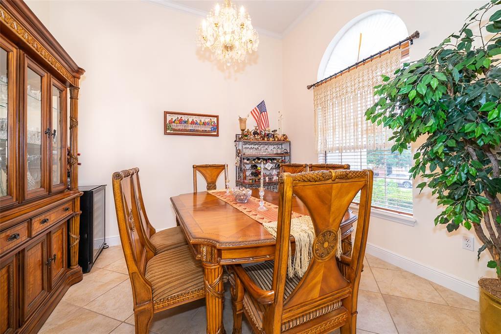 1607 Oak Hollow Road Clermont, FL 34711 - Photo 5 of 30 a view of a dining room with furniture and a potted plant