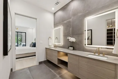 a bathroom with a double vanity sink and a