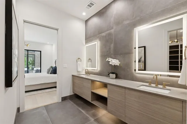 a bathroom with a double vanity sink and a