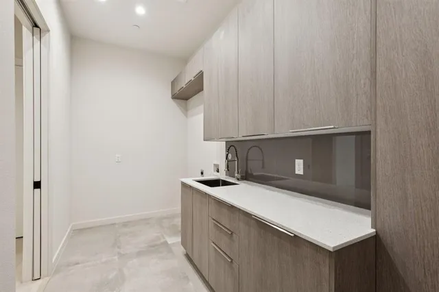 a kitchen with a sink and cabinets
