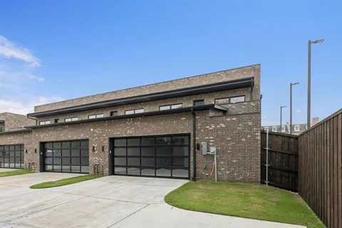 a view of a house with a small backyard