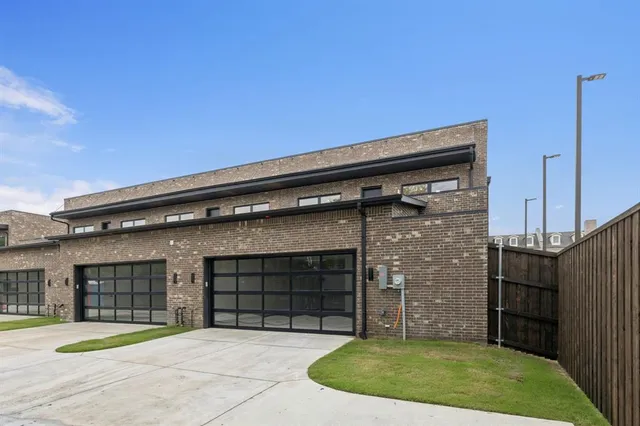 a view of a house with a small backyard