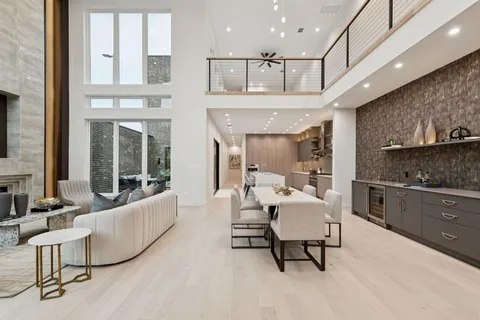 a living room with furniture and a kitchen