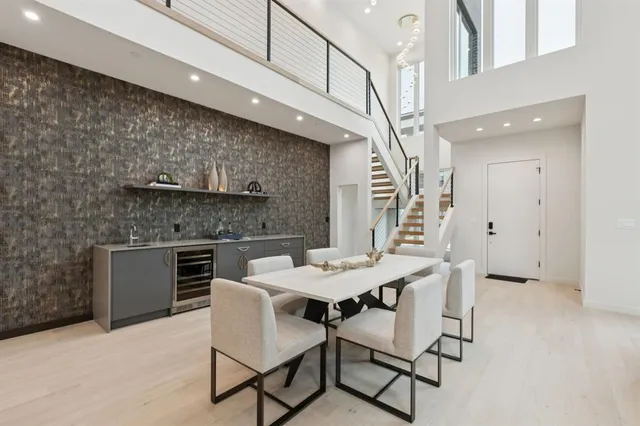 a kitchen with a table chairs and a stove