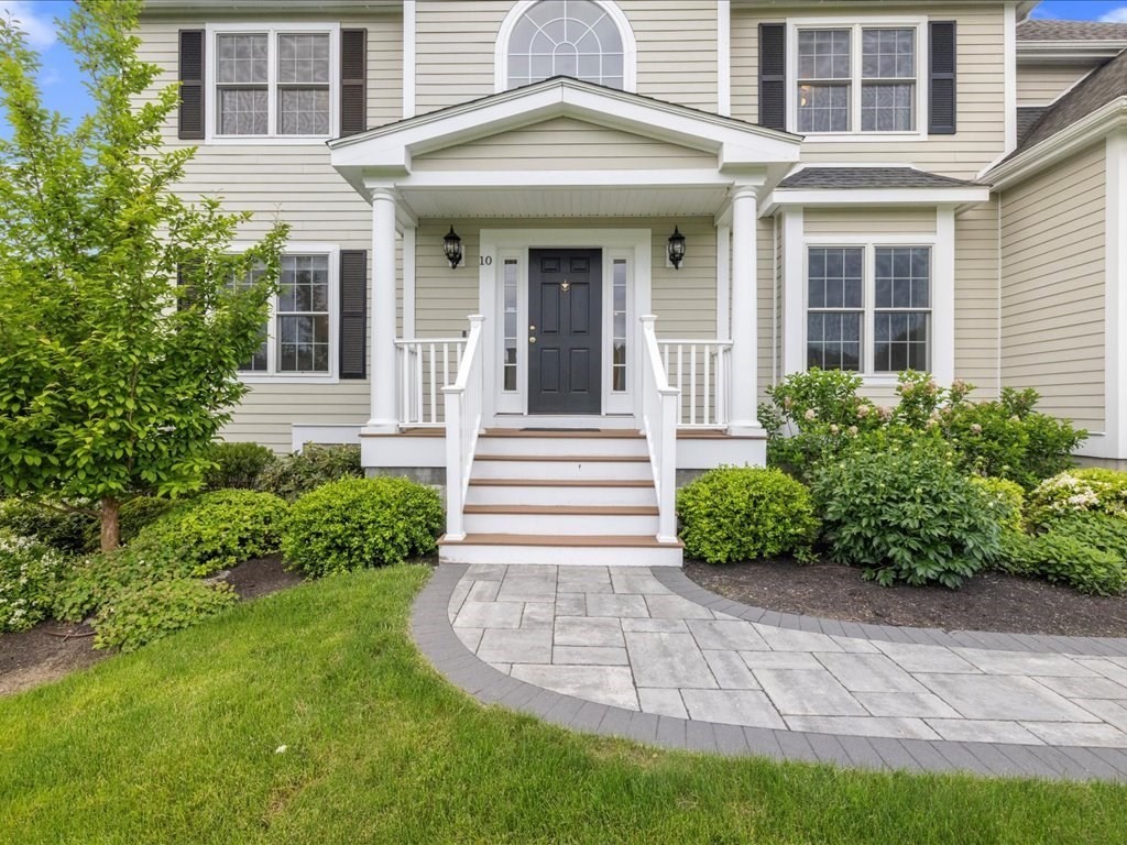 10 Beech Street Millis, MA 02054 - Photo 1 of 40 a front view of a house with garden