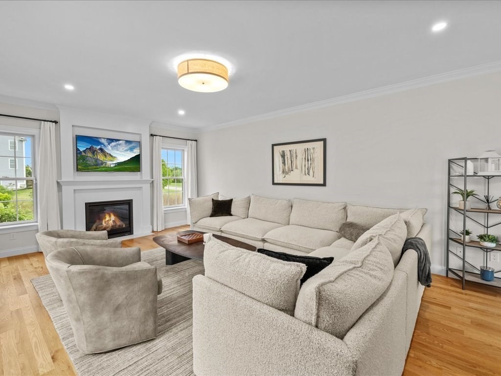 10 Beech Street Millis, MA 02054 - Photo 15 of 40 a living room with furniture and a fireplace