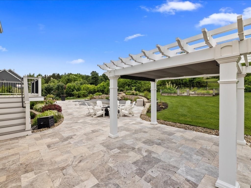 10 Beech Street Millis, MA 02054 - Photo 30 of 40 a view of a patio with table and chairs next to a yard