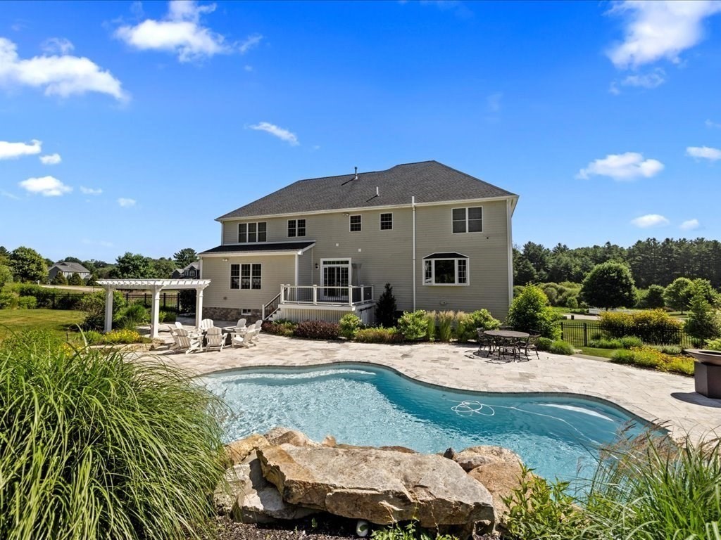 10 Beech Street Millis, MA 02054 - Photo 34 of 40 a house with pool in front of it
