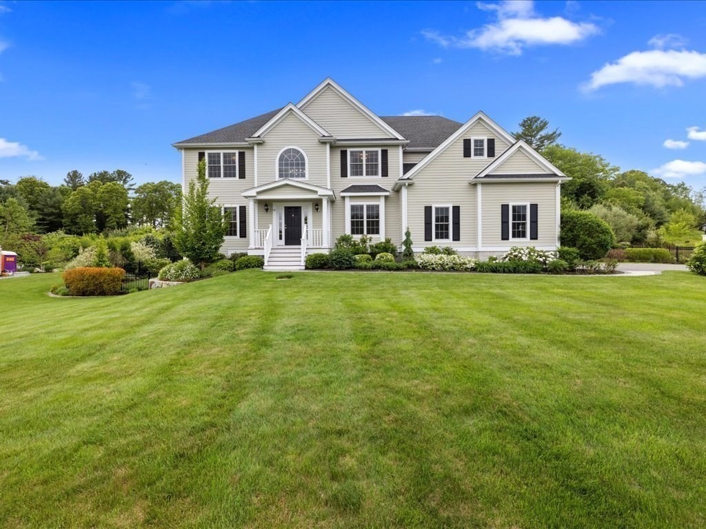 10 Beech Street Millis, MA 02054 - Photo 36 of 40 a view of a house with a big yard with potted plants and large trees