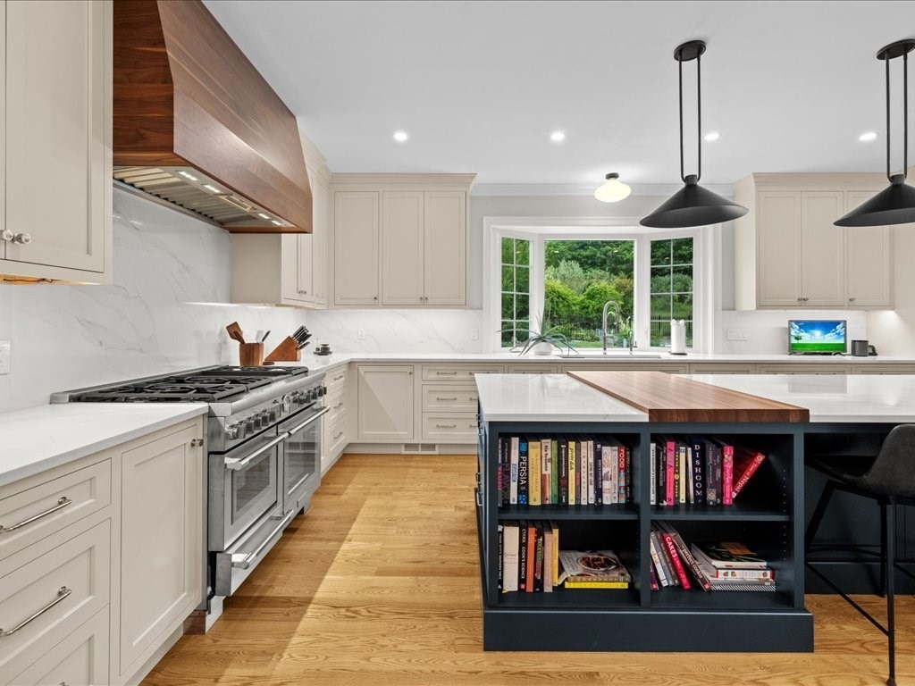 10 Beech Street Millis, MA 02054 - Photo 5 of 40 a kitchen with stainless steel appliances granite countertop a stove and a refrigerator