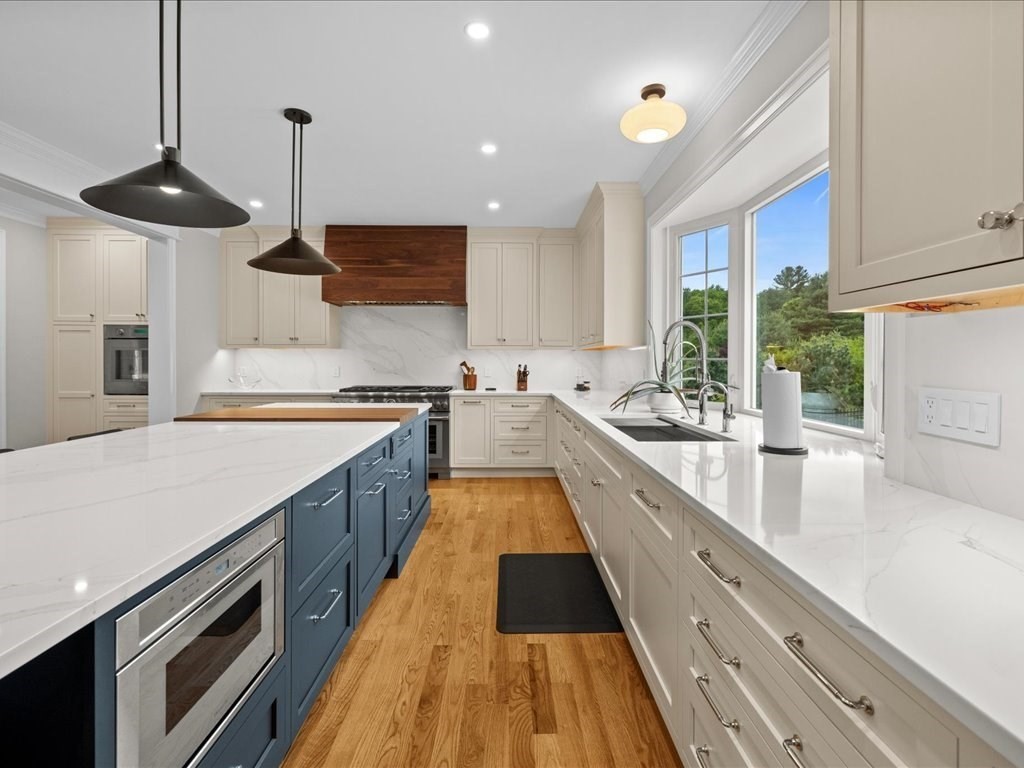 10 Beech Street Millis, MA 02054 - Photo 7 of 40 a large kitchen with stainless steel appliances lots of counter space and a sink