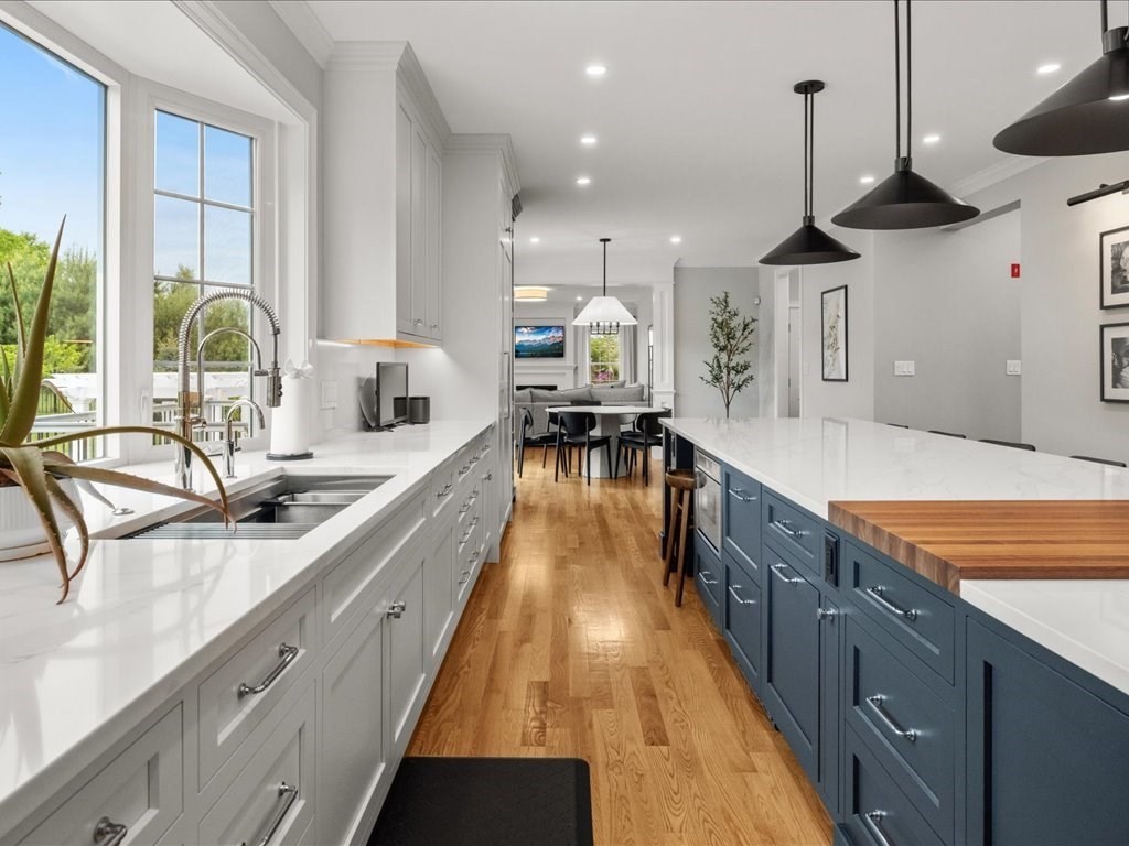 10 Beech Street Millis, MA 02054 - Photo 8 of 40 a large kitchen with stainless steel appliances kitchen island granite countertop a large island in the center