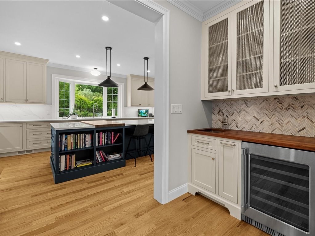 10 Beech Street Millis, MA 02054 - Photo 9 of 40 a kitchen with stainless steel appliances granite countertop a stove and a wooden cabinets