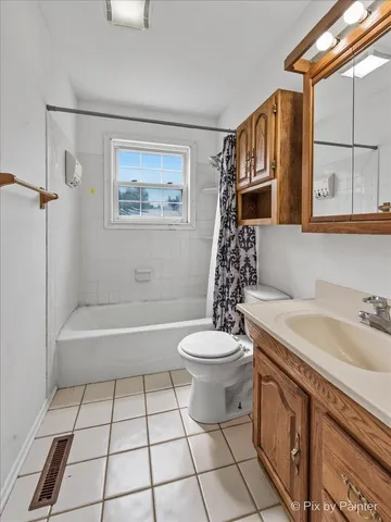 a bathroom with a sink a toilet and bathtub