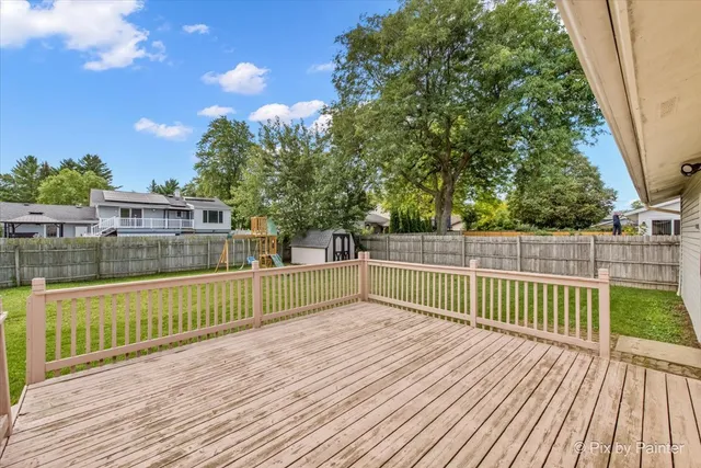 a view of a balcony with wooden floor