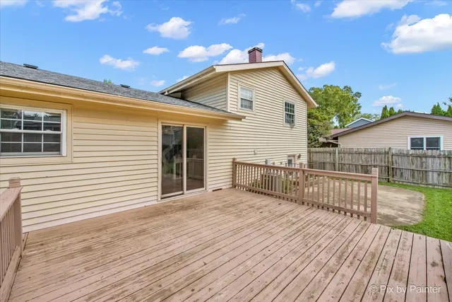a view of a house with wooden deck