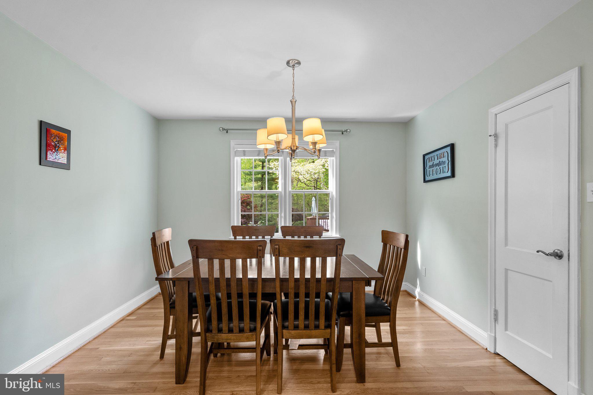 10406 Brookmoor Drive Silver Spring, MD 20901 - Photo 12 of 45 a view of a dining room with furniture window and wooden floor