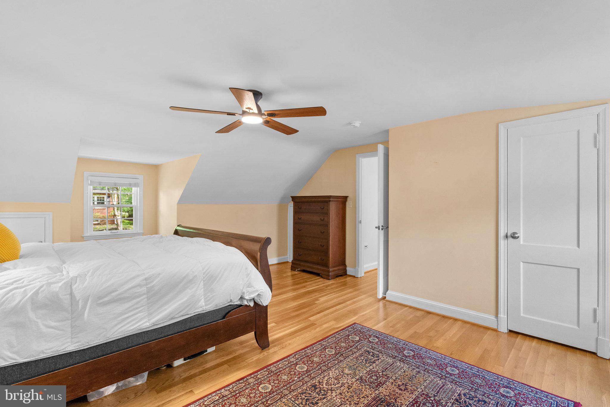 10406 Brookmoor Drive Silver Spring, MD 20901 - Photo 21 of 45 a bedroom with a bed a dresser and a window