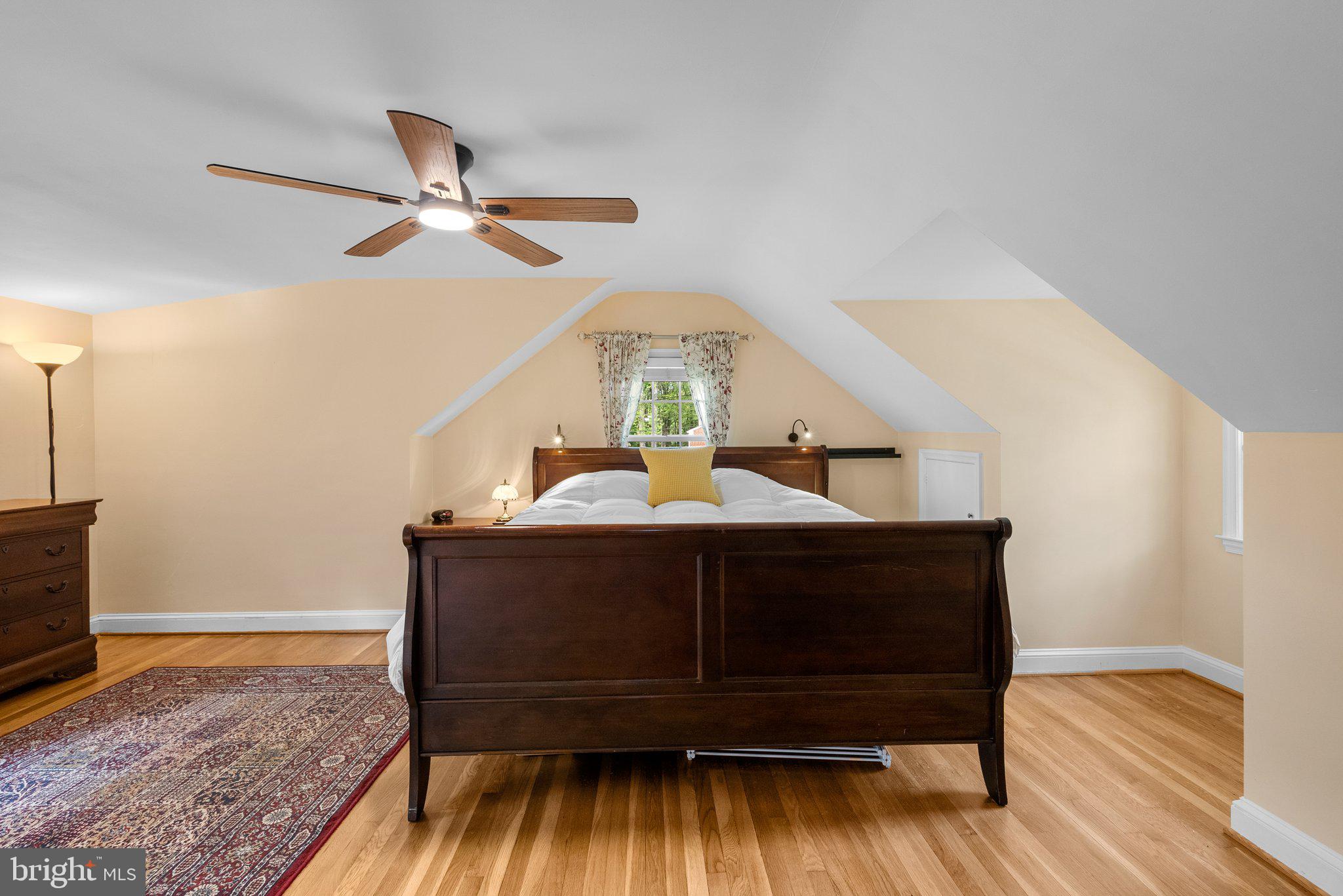 10406 Brookmoor Drive Silver Spring, MD 20901 - Photo 22 of 45 a bedroom with a bed and wooden floor