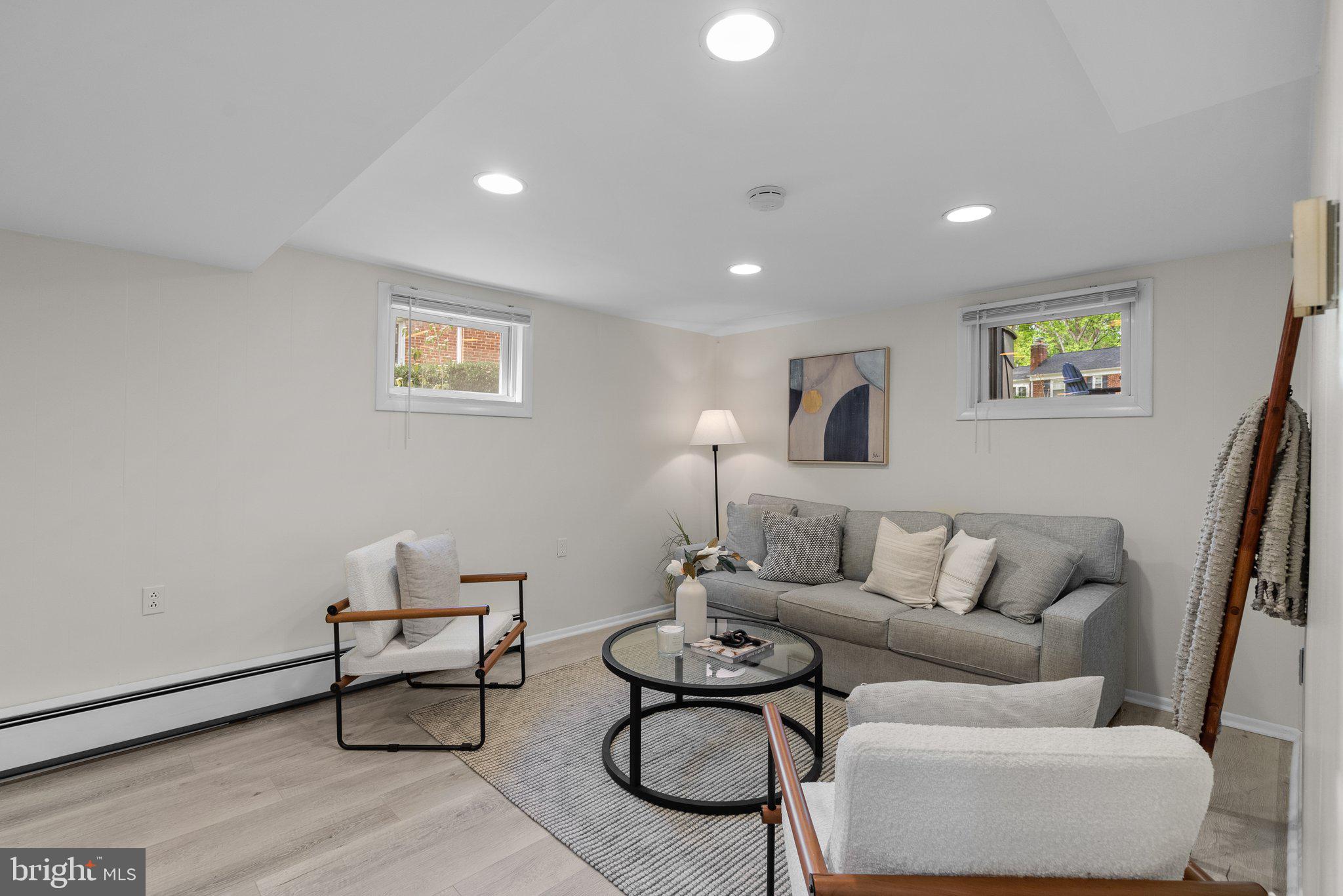 10406 Brookmoor Drive Silver Spring, MD 20901 - Photo 26 of 45 a living room with furniture and a rug