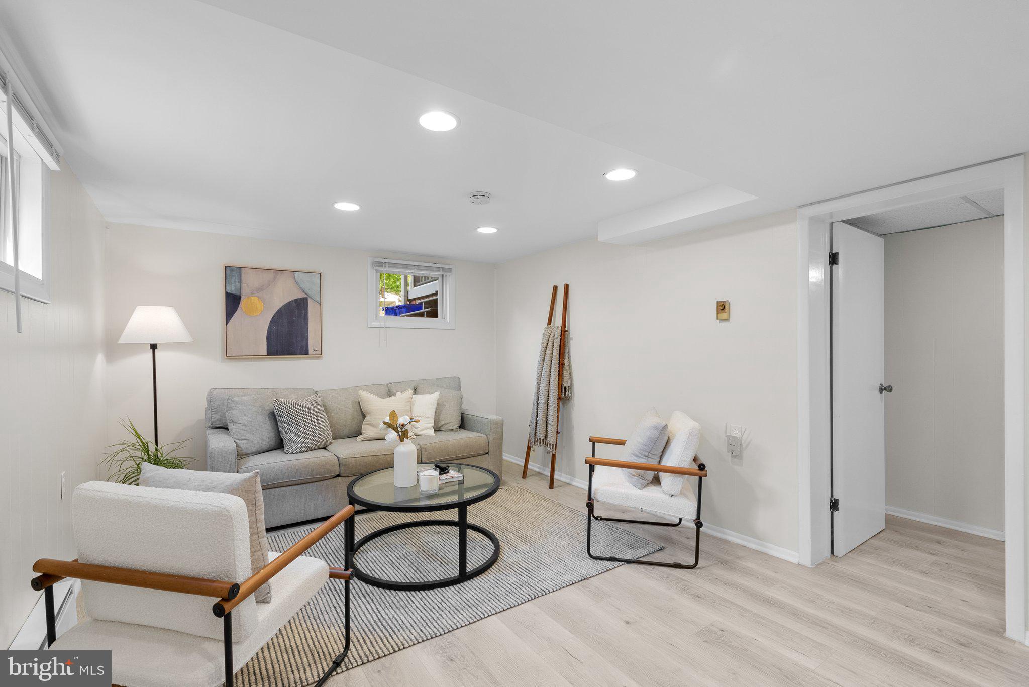 10406 Brookmoor Drive Silver Spring, MD 20901 - Photo 27 of 45 a living room with furniture and white walls