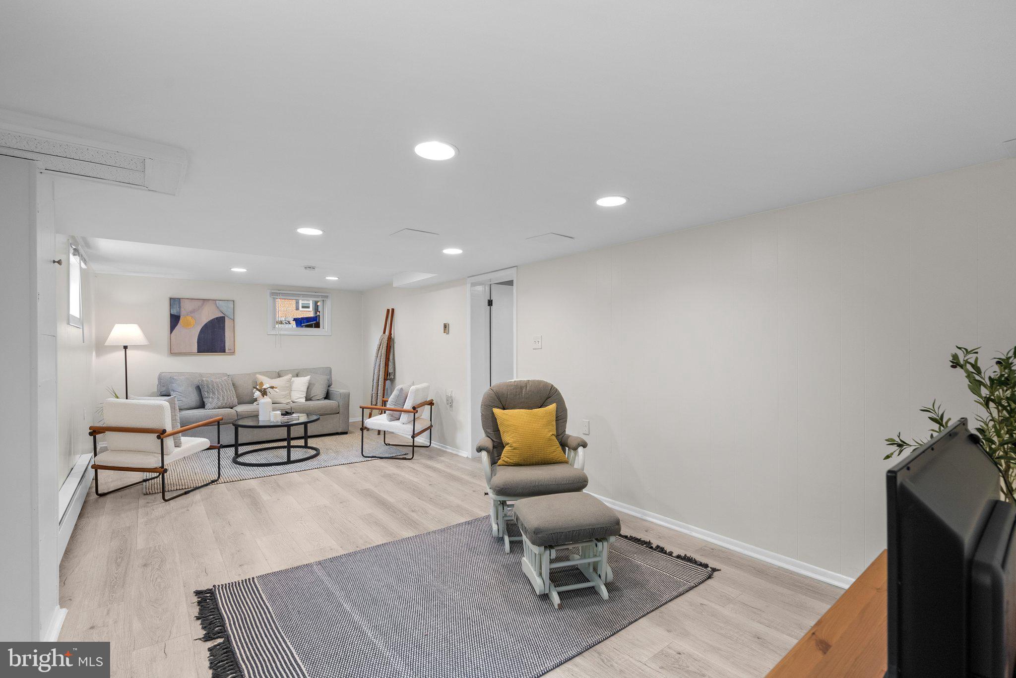 10406 Brookmoor Drive Silver Spring, MD 20901 - Photo 28 of 45 a living room with furniture and wooden floor