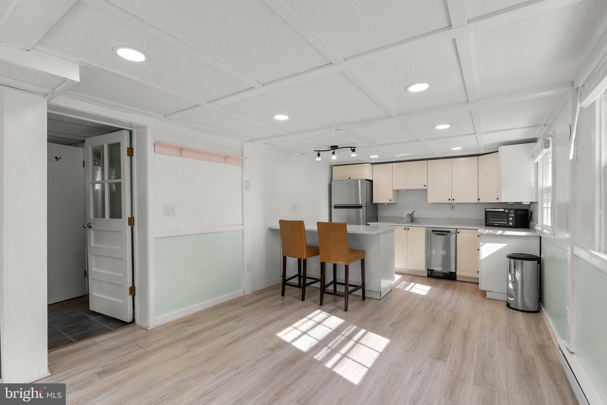 10406 Brookmoor Drive Silver Spring, MD 20901 - Photo 32 of 45 a kitchen with white cabinets and counter space